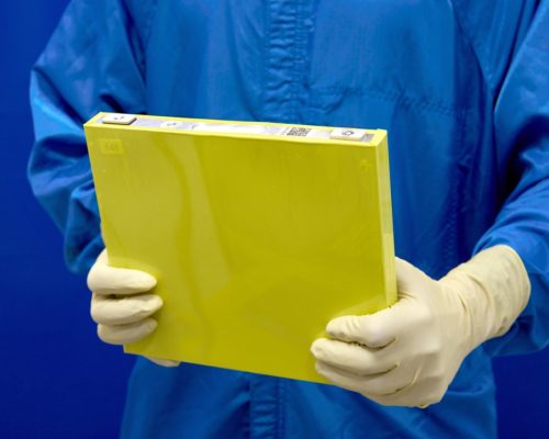 An employee holds a full-size prototype LMR battery cell at the General Motors Wallace Battery Cell Innovation Center. GM has prototyped approximately 300 full-size LMR cells as it worked with LG Energy Solution to crack the code on the chemistry. (Photo by Steve Fecht for General Motors)